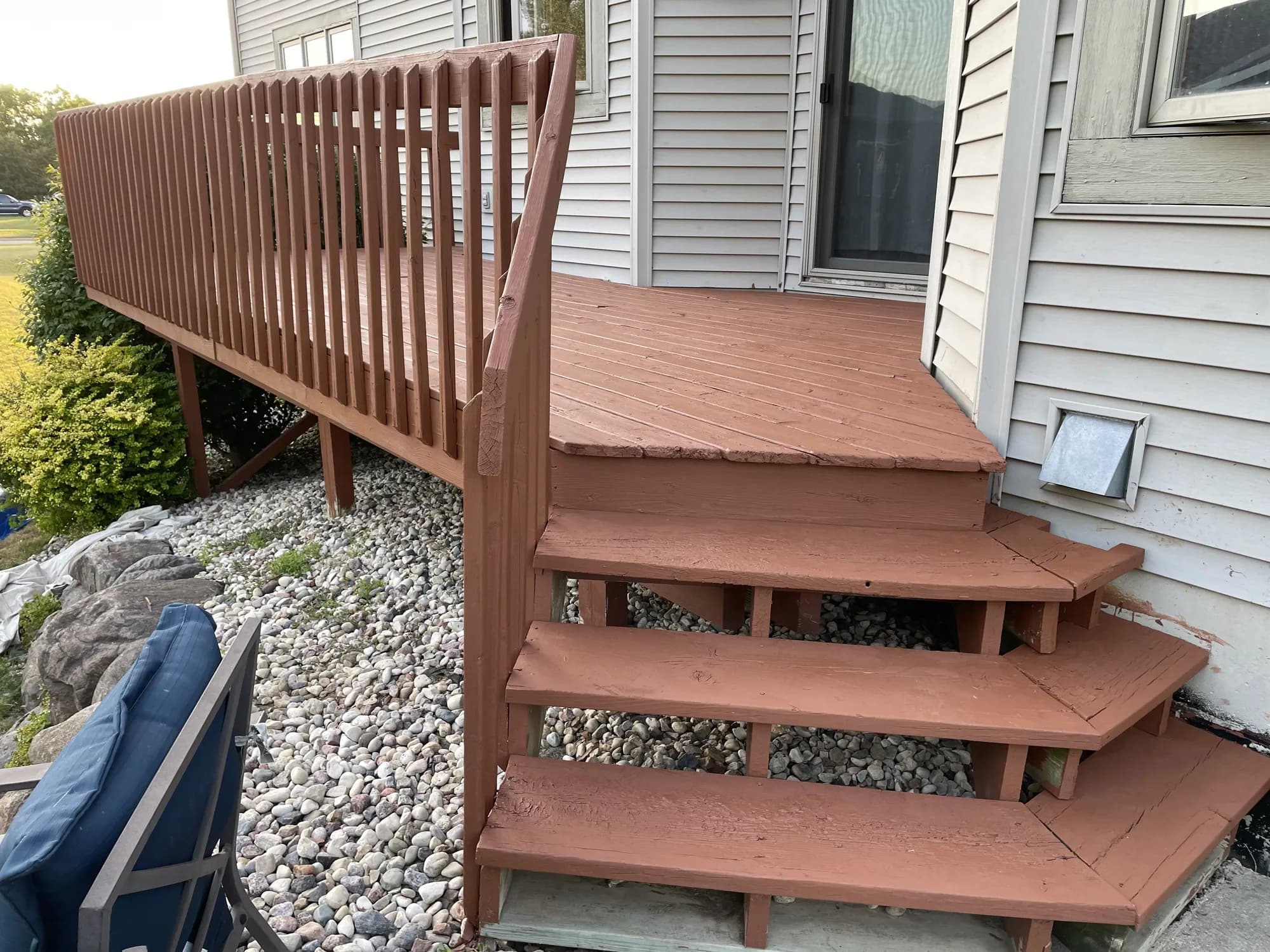 Freshly stained cedar deck — rich warm wood grain and sharp clean lines